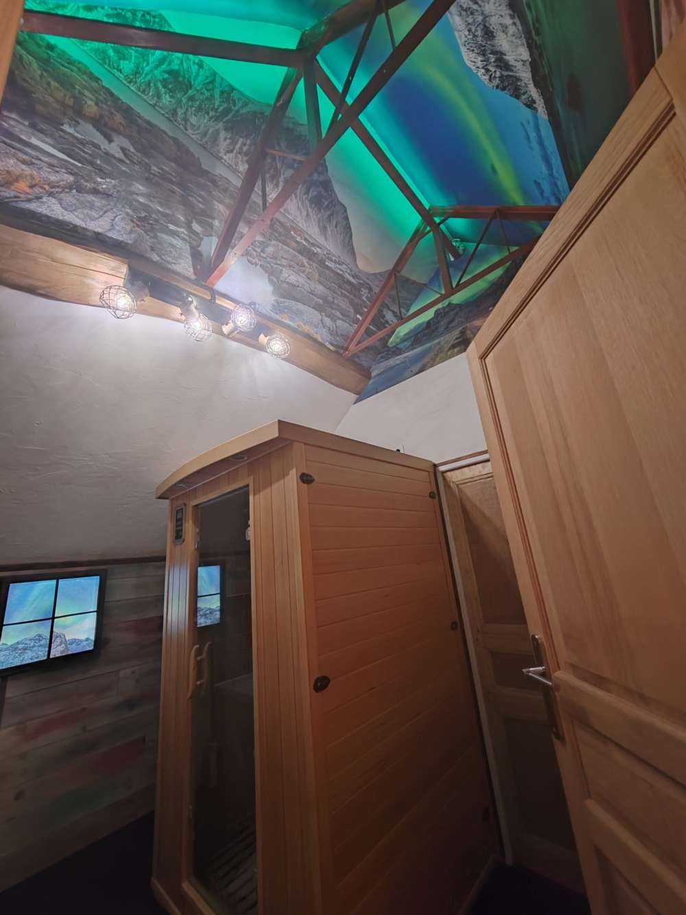 Northern lights above snowy mountains