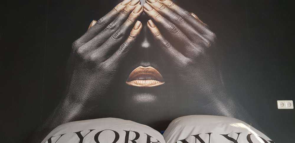 Woman with hands in front of her eyes