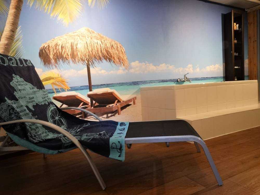 Chairs and parasol on tropical beach