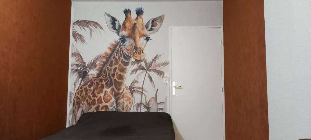 Baby giraffe in the jungle taupe