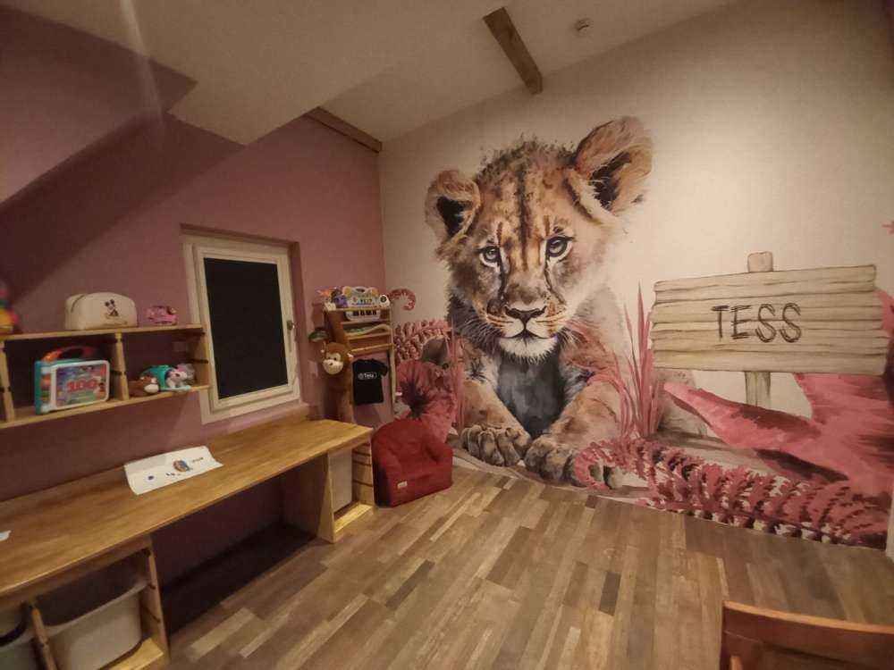 Young lion in the jungle pink