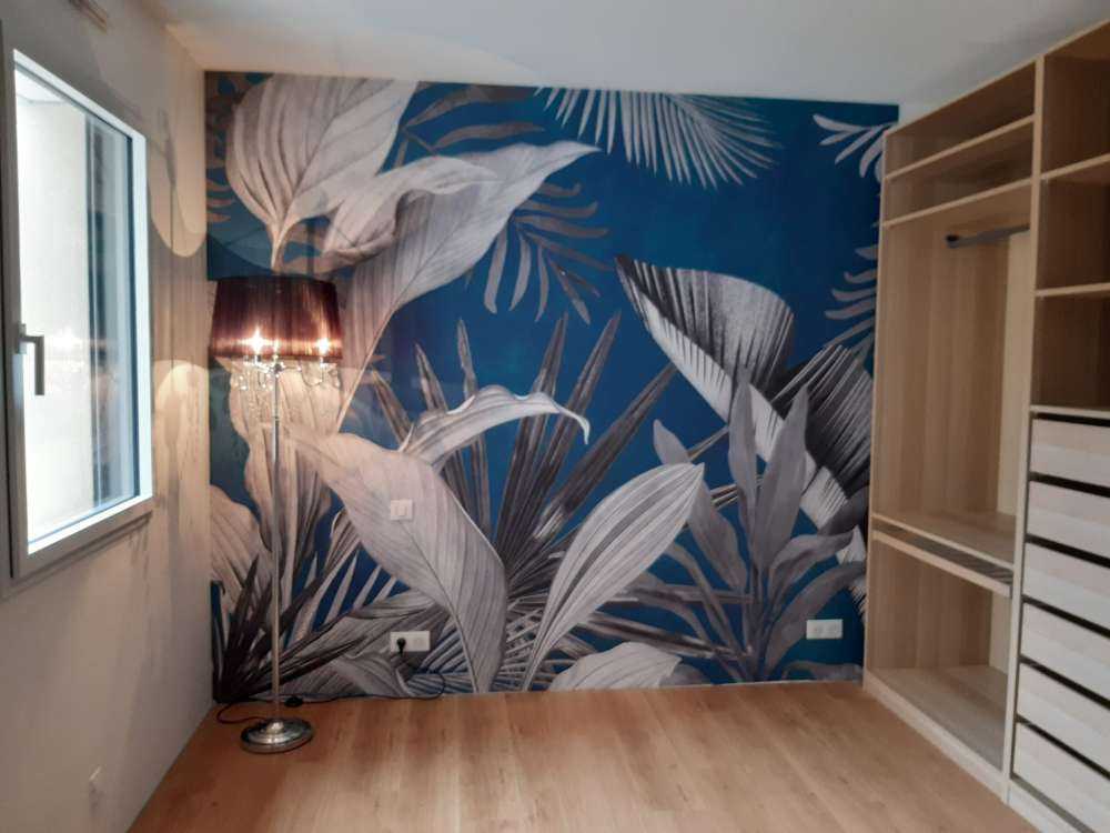 Tropical leaves on a blue background