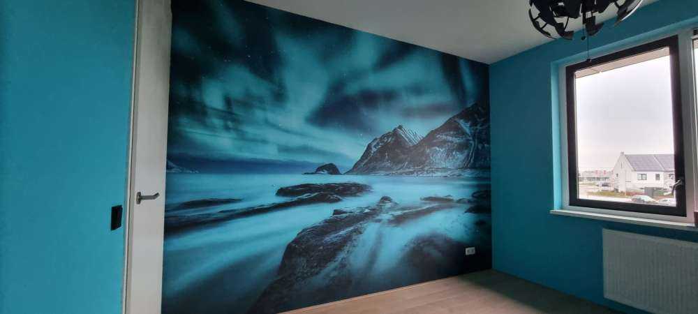 Blue northern lights with mountains