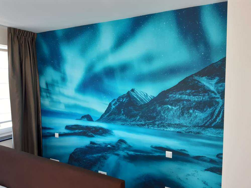 Blue northern lights with mountains