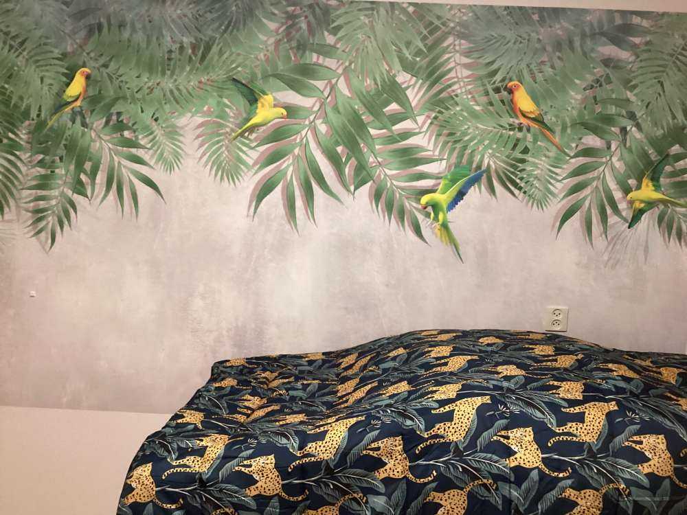 Tropical leaves and parakeets