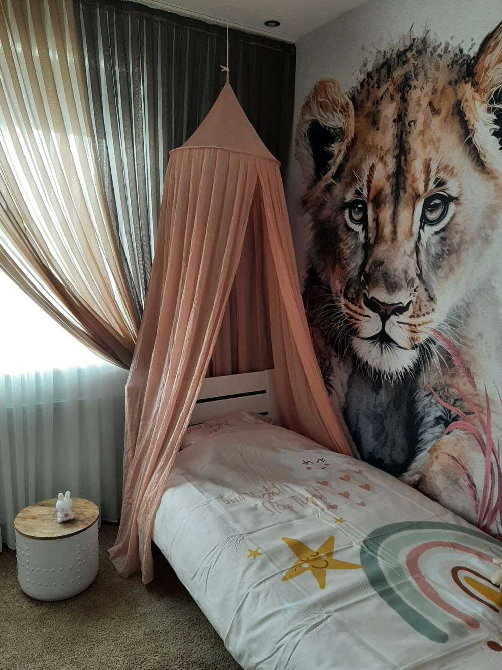 Young lion in the jungle pink