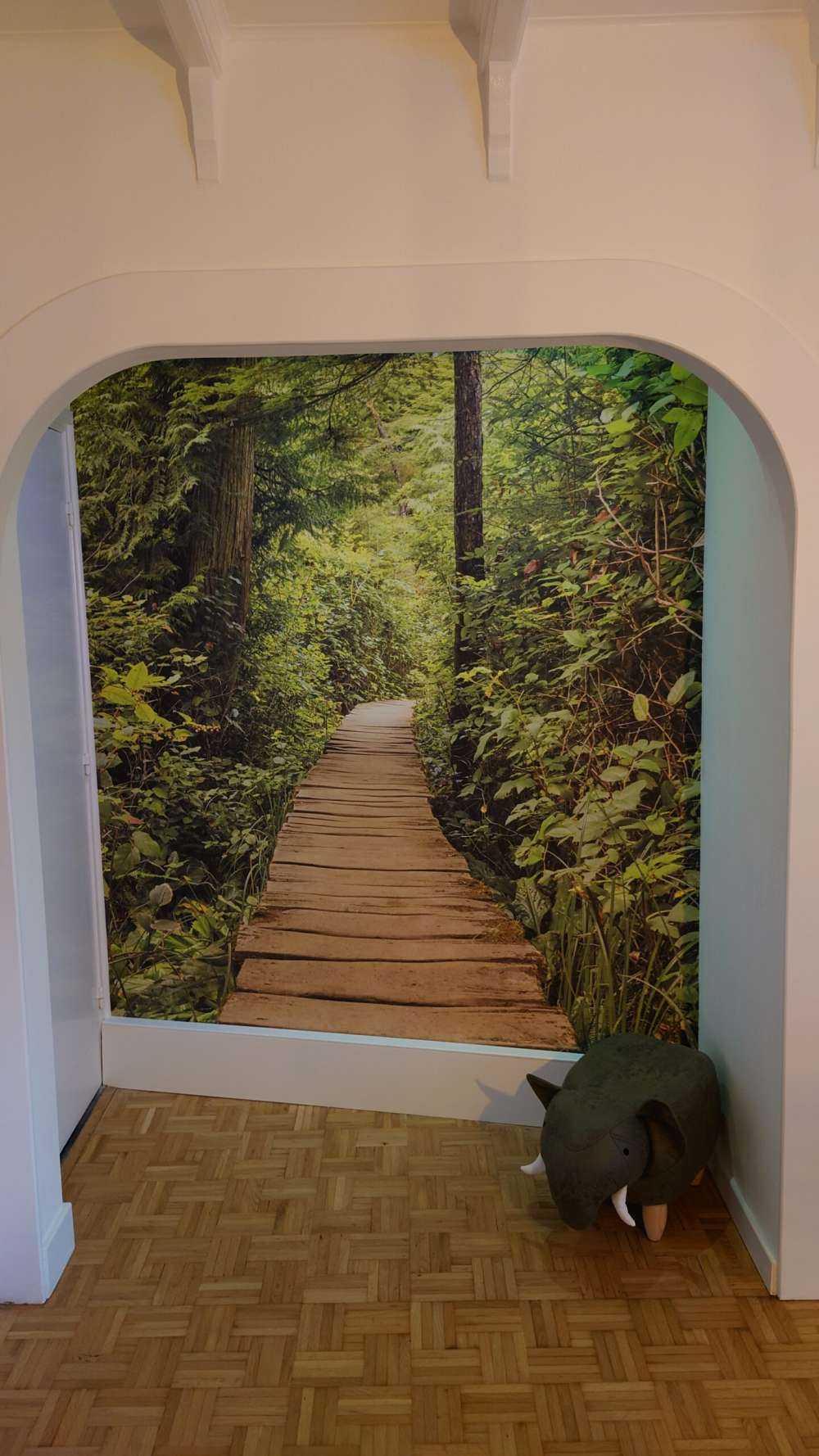 Wooden path through the green