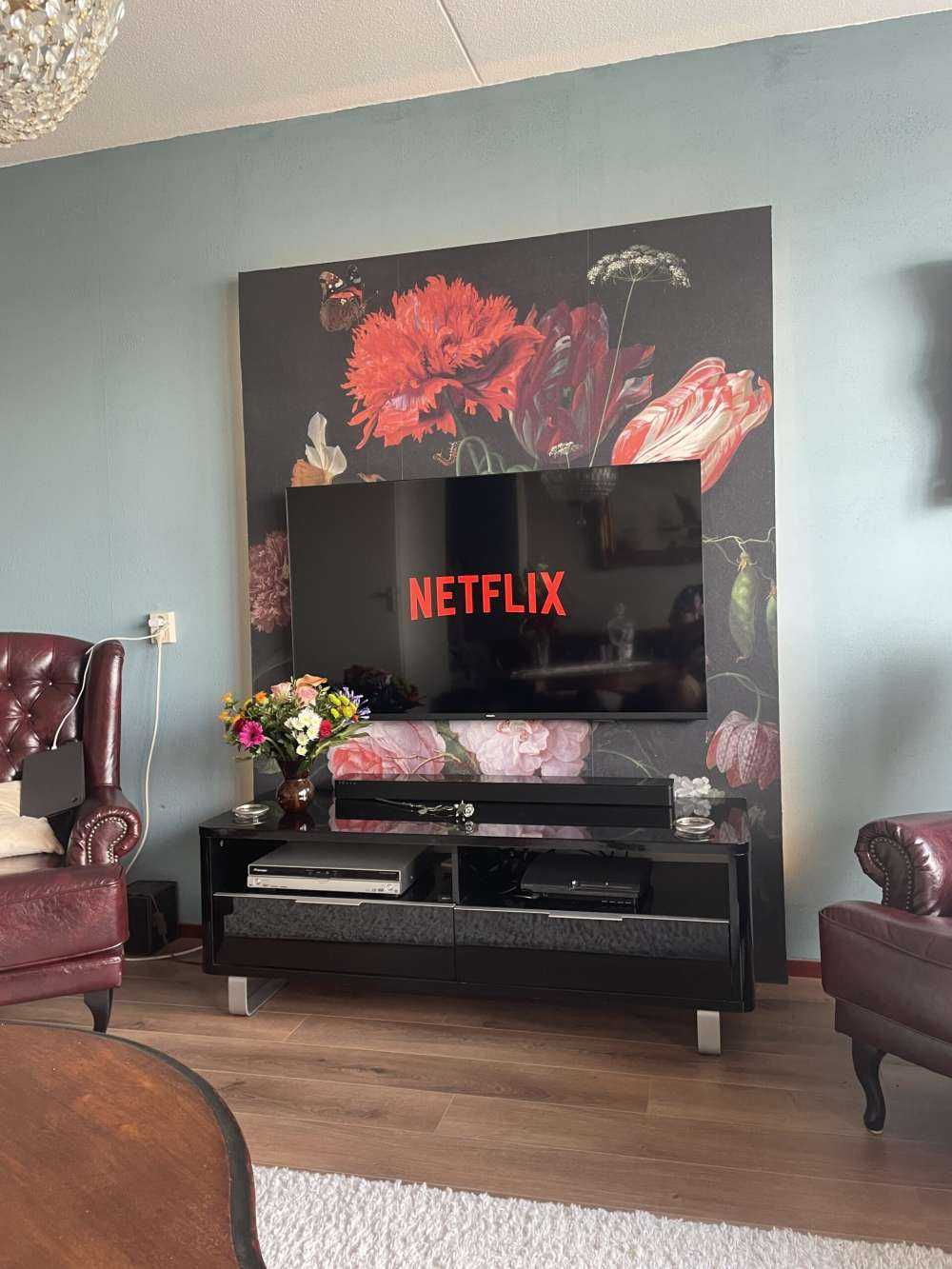 Still life with flowers in a glass vase