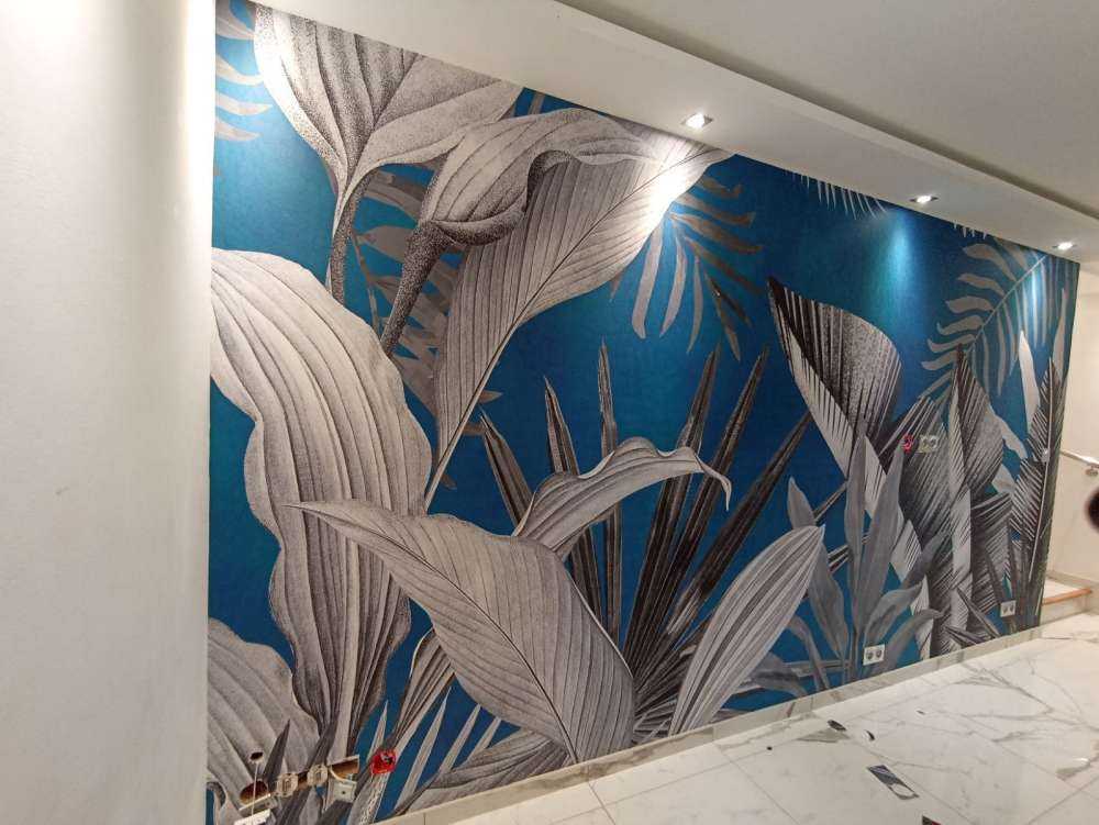 Tropical leaves on a blue background