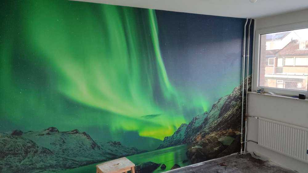 Northern lights between two fjords