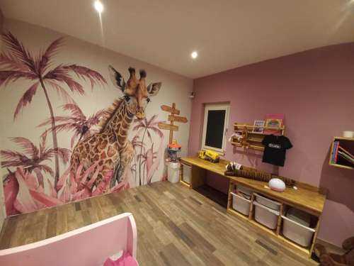Baby giraffe in the jungle pink