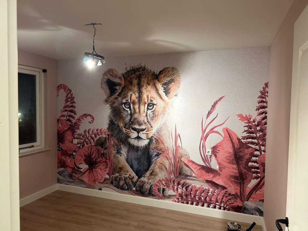 Young lion in the jungle pink