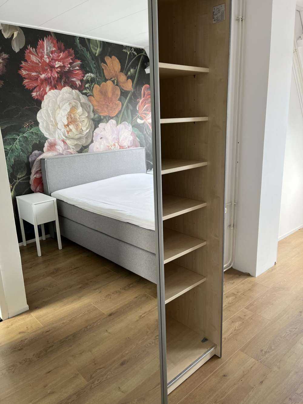 Still life with flowers in a glass vase