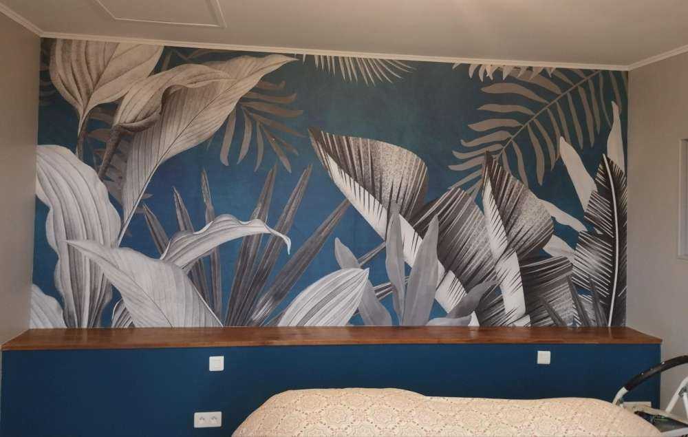 Tropical leaves on a blue background