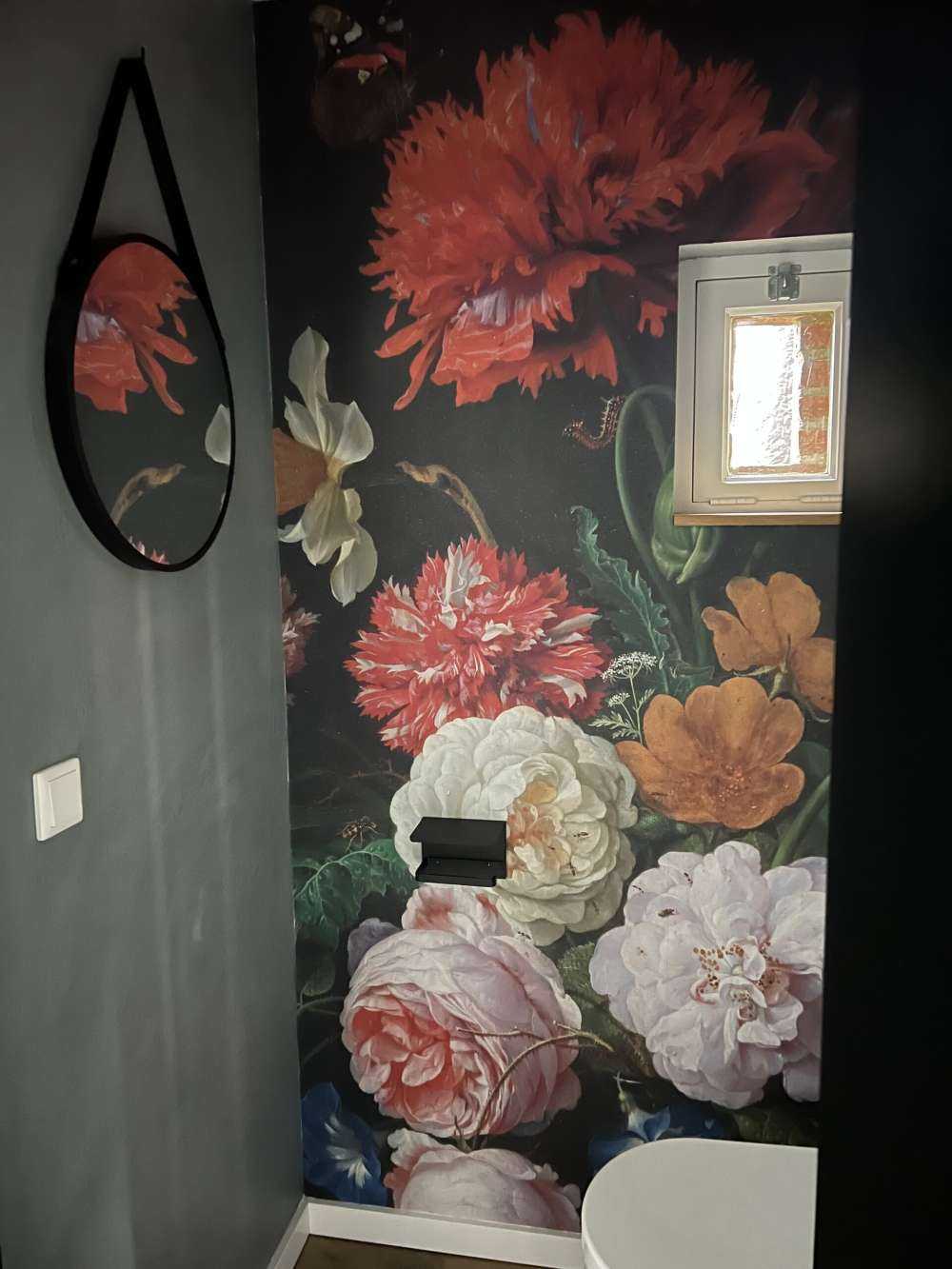 Still life with flowers in a glass vase