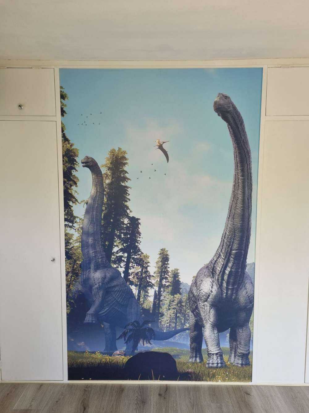 Alamosaurus group walking through a valley