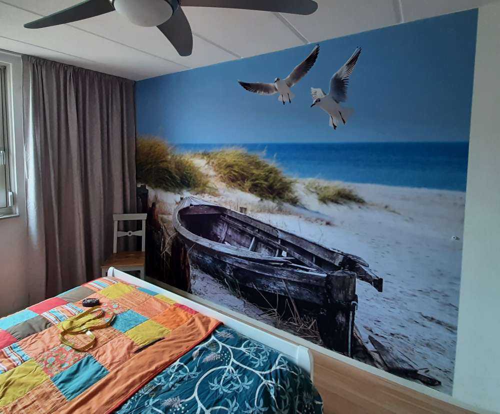 Old fishing boat, seagulls, beach and sea