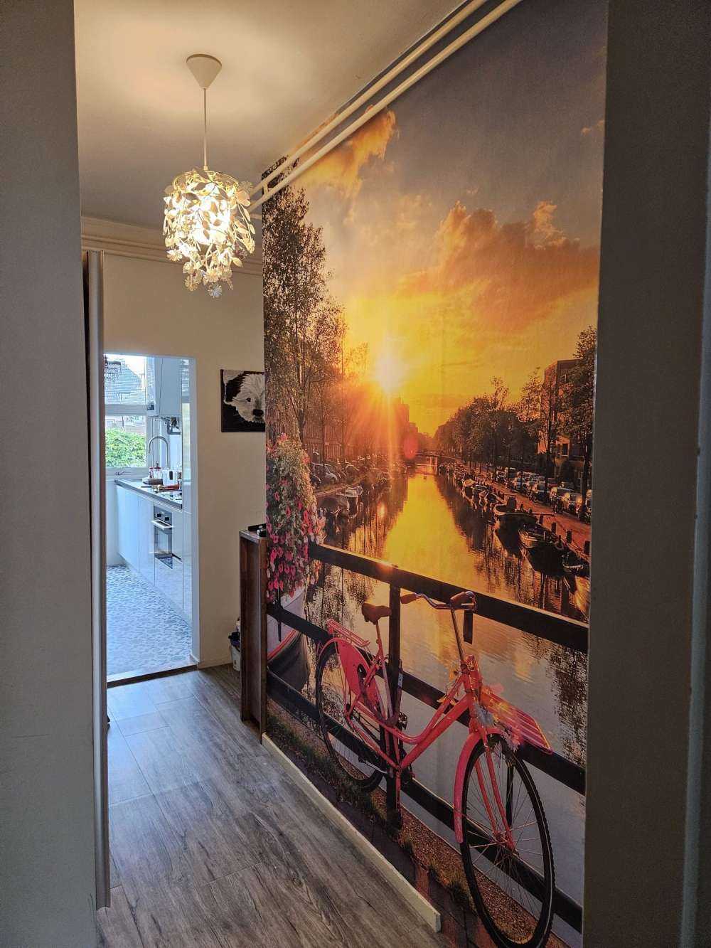 Cycling on a bridge with flowers