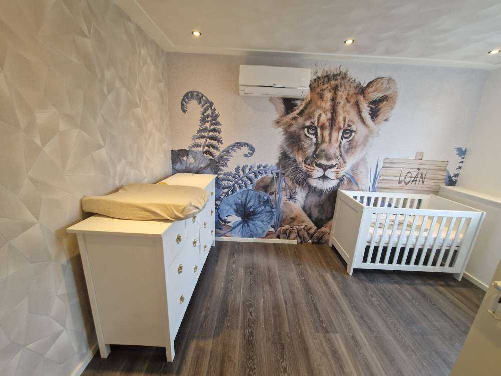 Young lion in the jungle blue