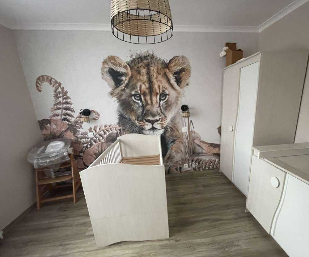 Baby lion in the jungle taupe