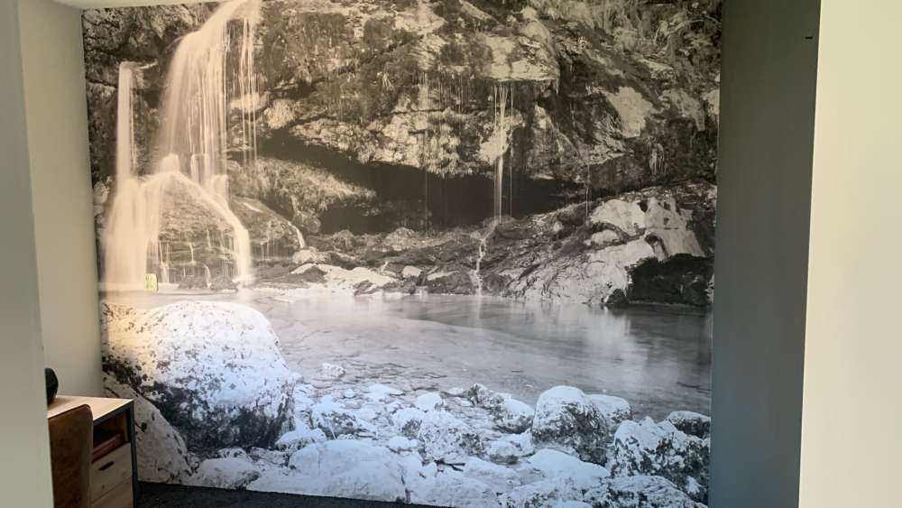 Waterfall over a stone wall