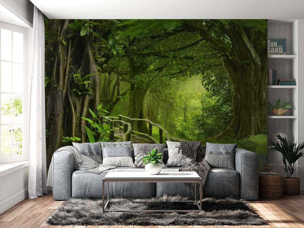 Wooden bridge through a green jungle