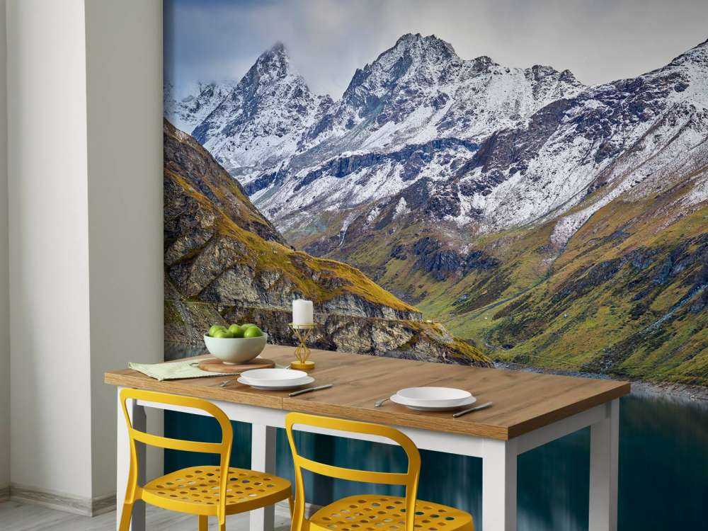 Mountain peaks with snow near mountain lake