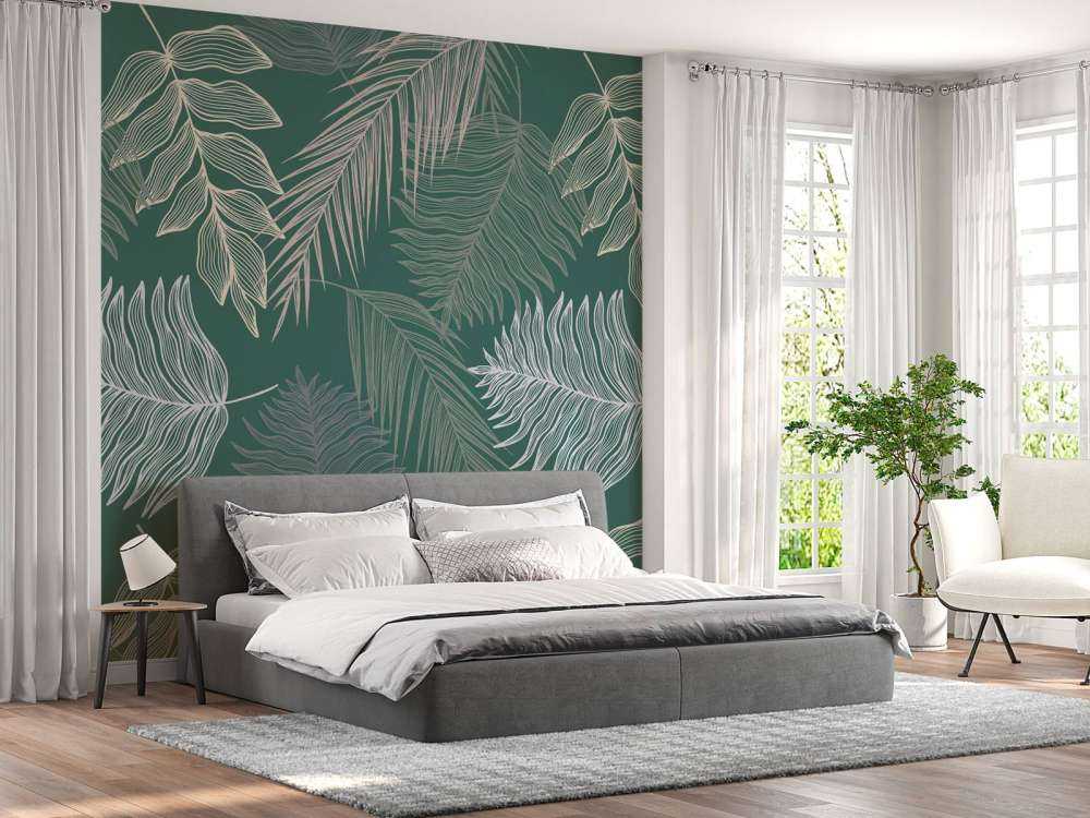 Palm leaf on green background