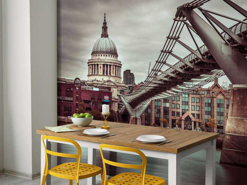 View of St Paul's Cathedral and Millennium Bridge from river thames, London, UK