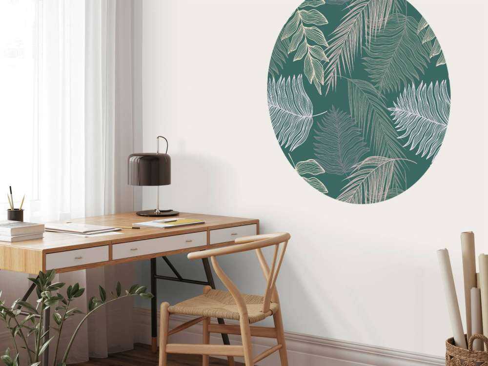 Palm leaf on green background