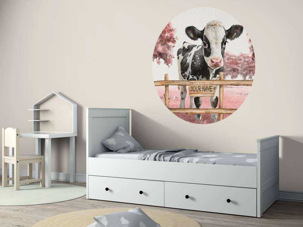 Young cow in a meadow pink