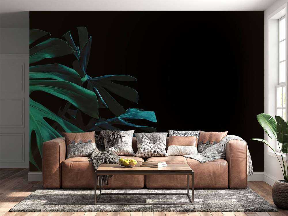 Tropical leaves on black background