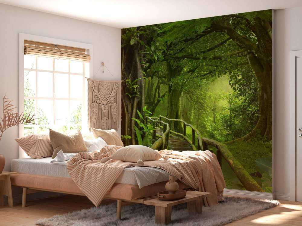 Wooden bridge through a green jungle