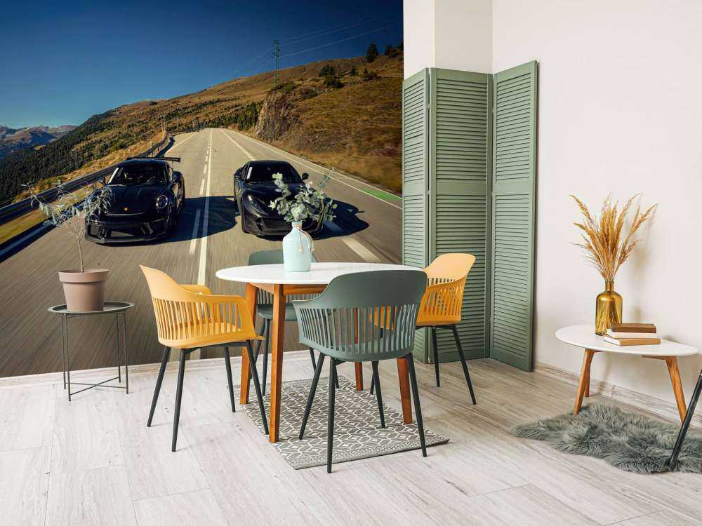 Black supercars in the mountains