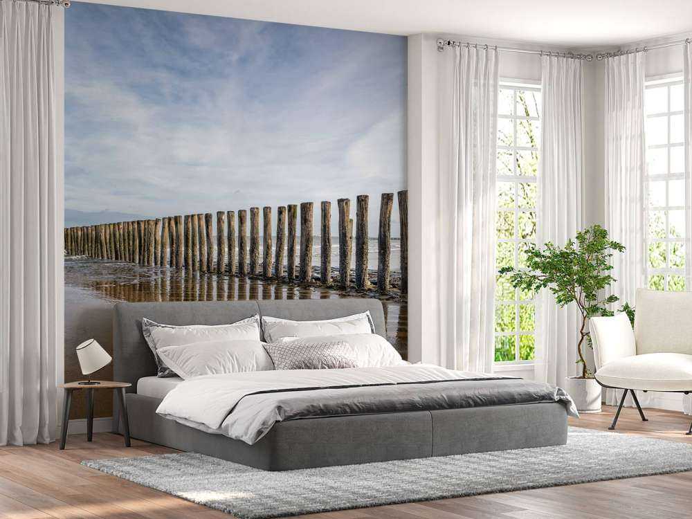 Wooden breakwater on the coast at Cadzand bath