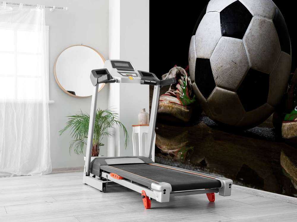 Football between two sneakers