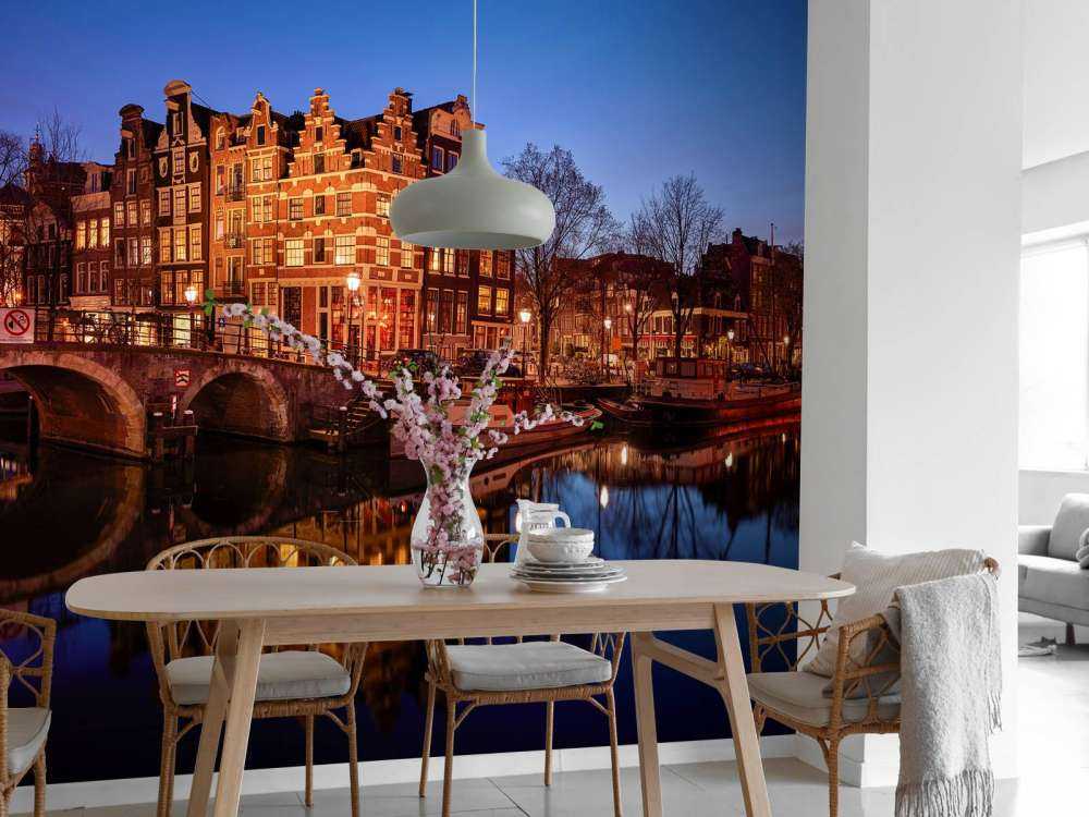 Illuminated houses along the canal