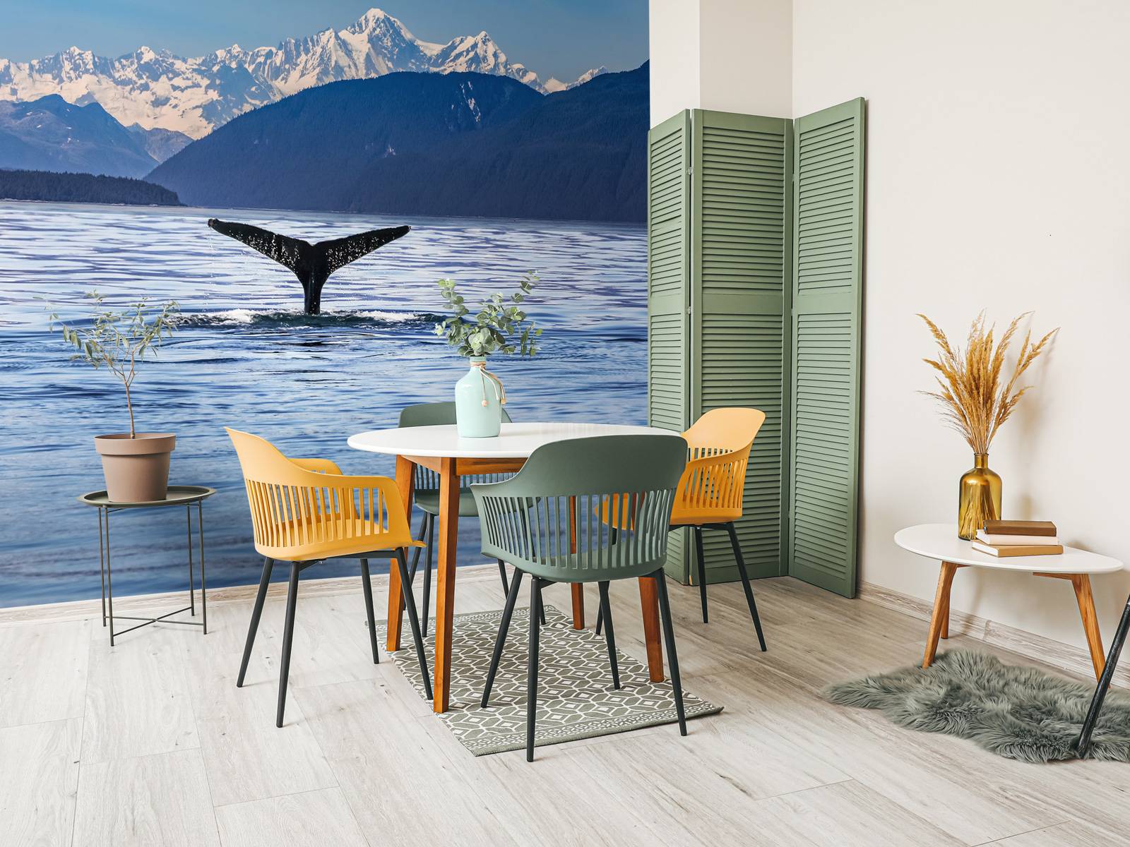 Diving whale with mountains in the background