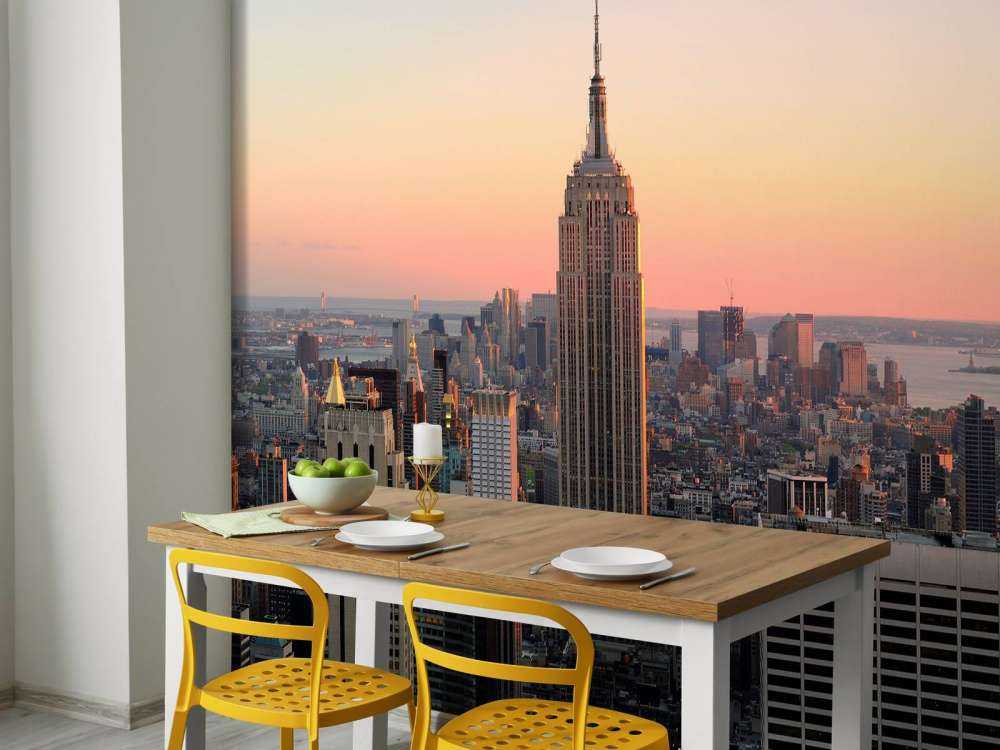 De Skyline van New York bij zonsondergang