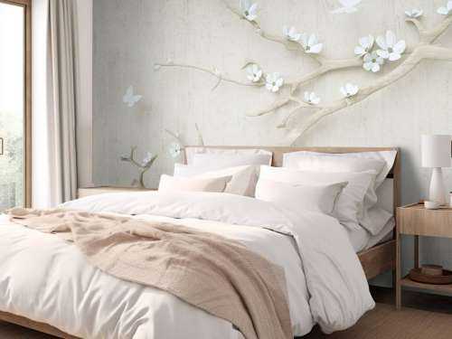 Branch with white flowers on wooden background