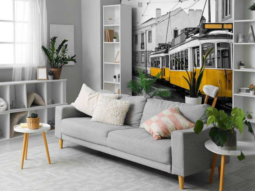 Yellow tram in a black and white street