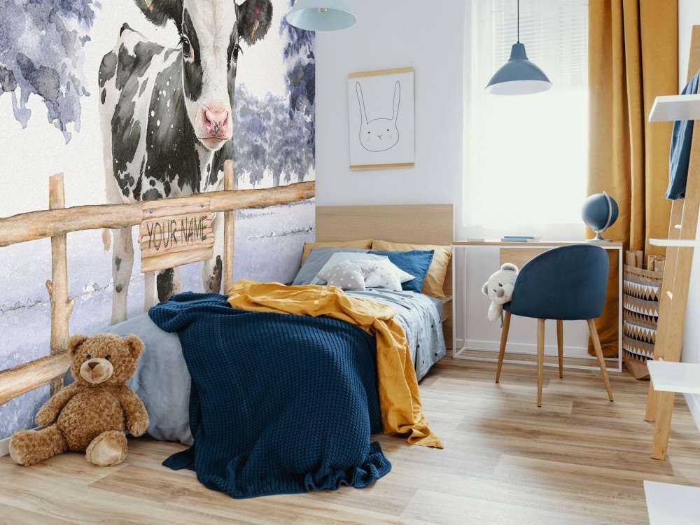 Young cow in a meadow blue