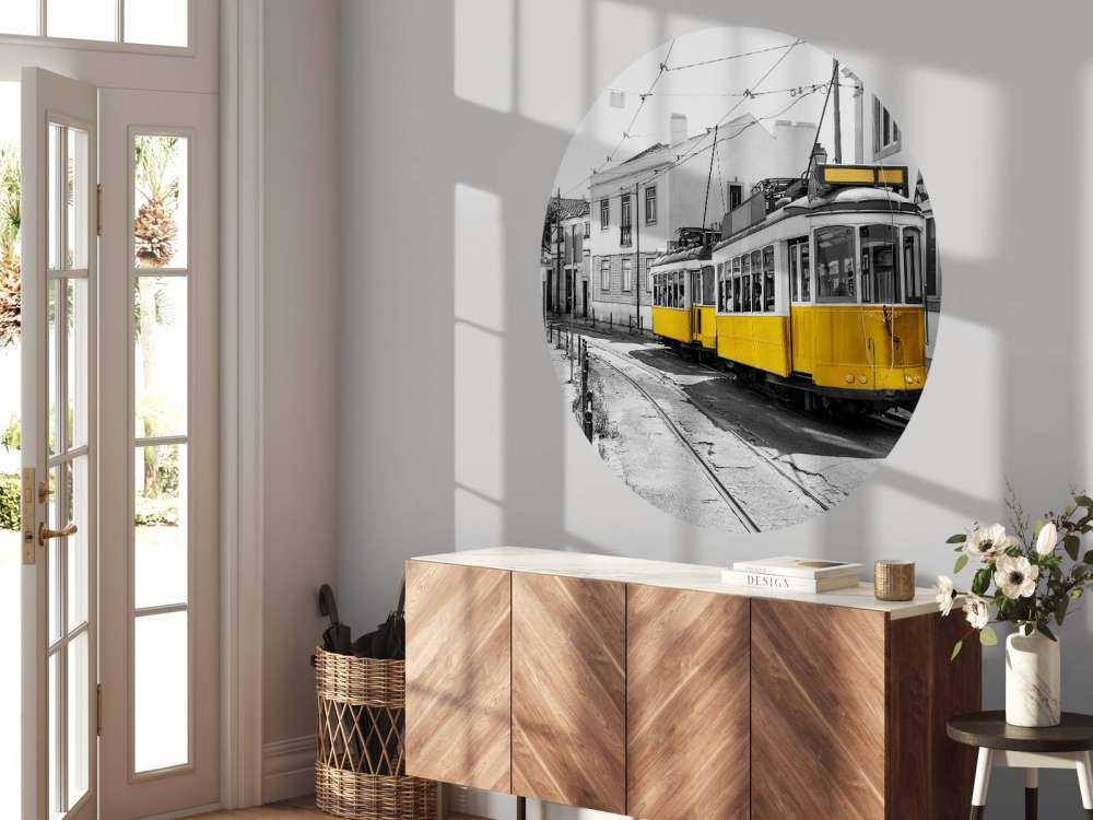 Yellow tram in a black and white street