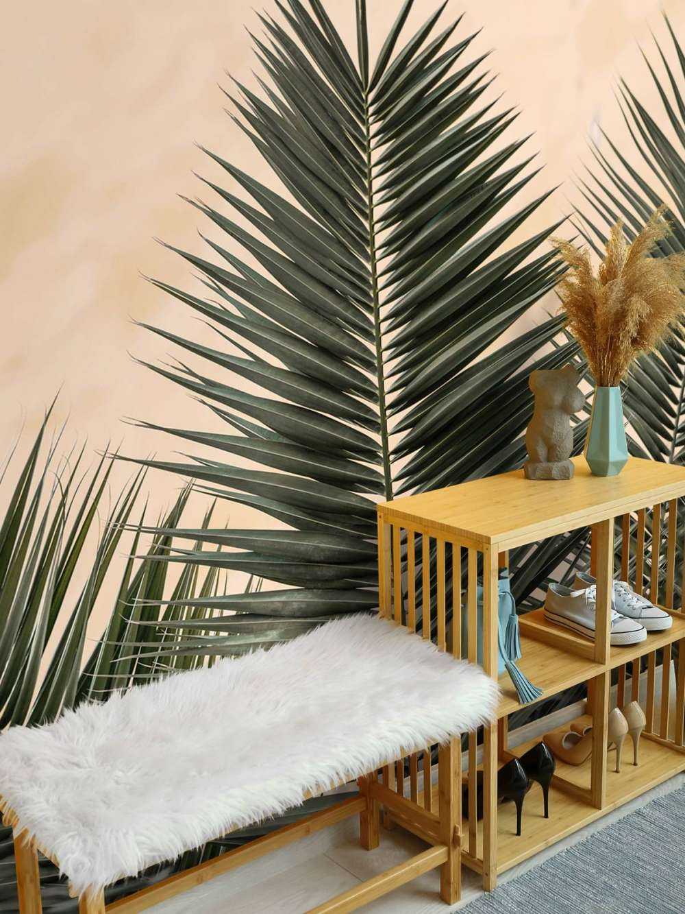Palm leaves and wall