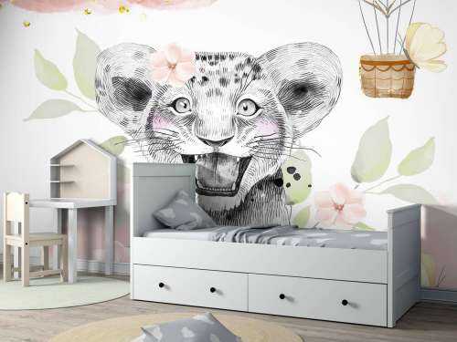 Joyful lion cub and balloon