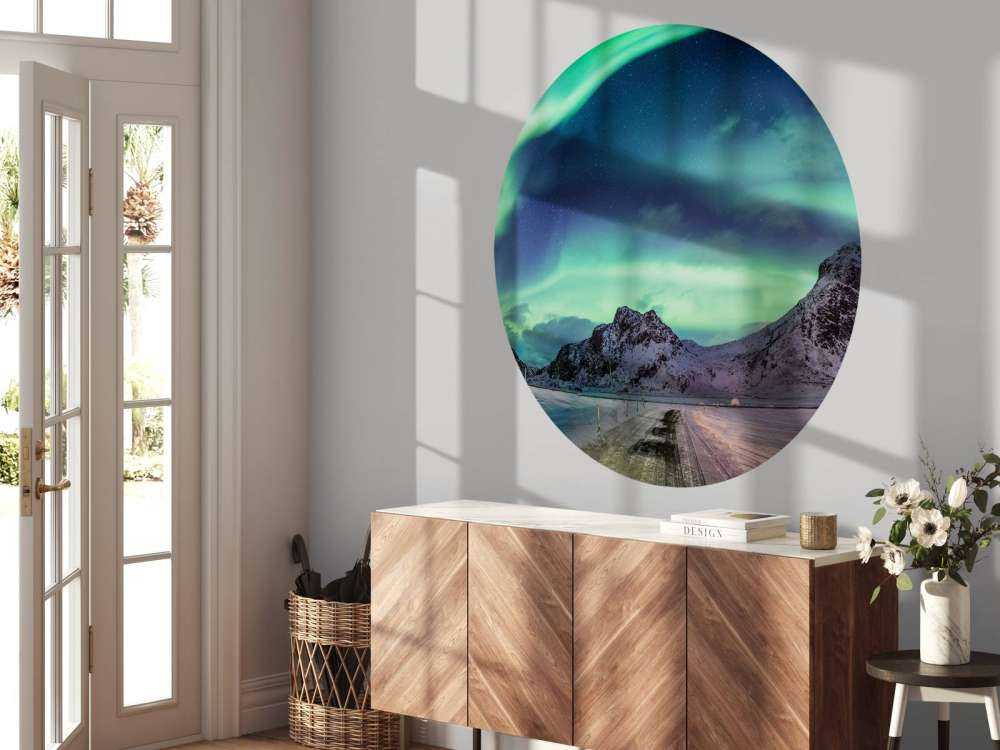 Northern lights above snowy mountains