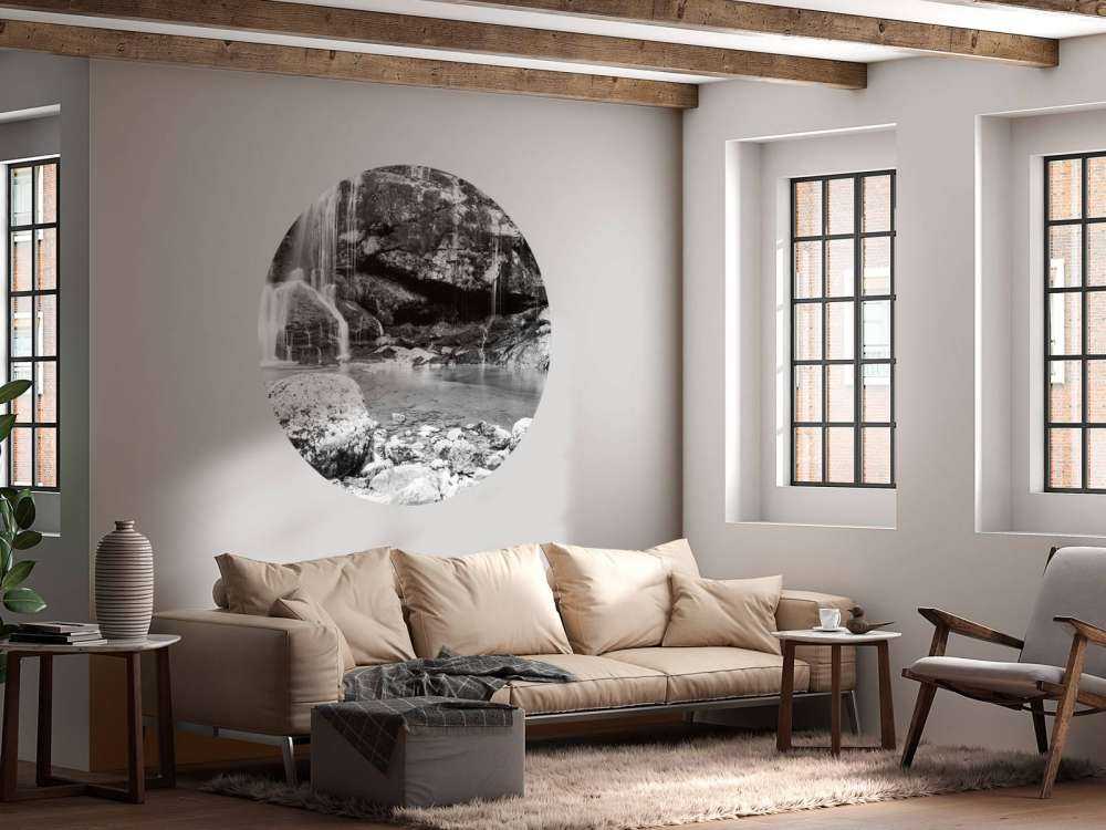 Waterfall over a stone wall