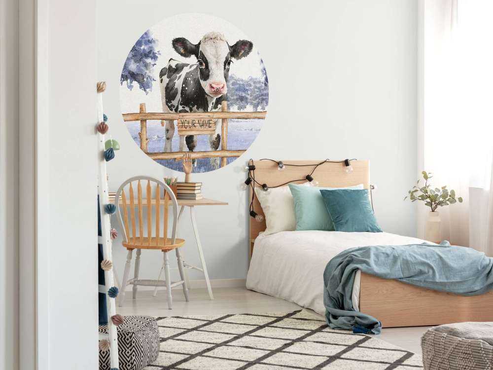 Young cow in a meadow blue