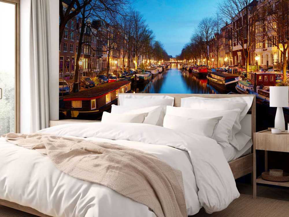 Houseboats along illuminated canal