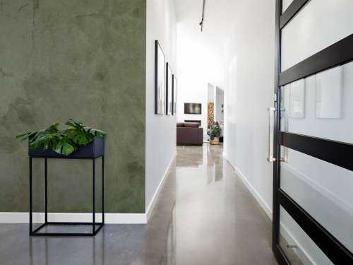 Green concrete with sweeping cracks
